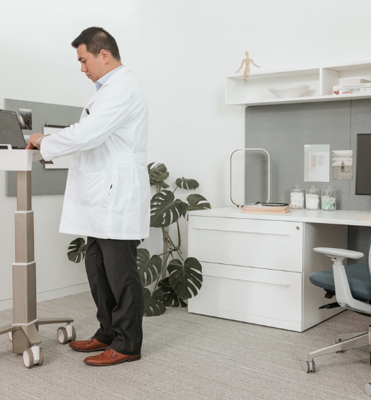 Doctor working on adjustable table