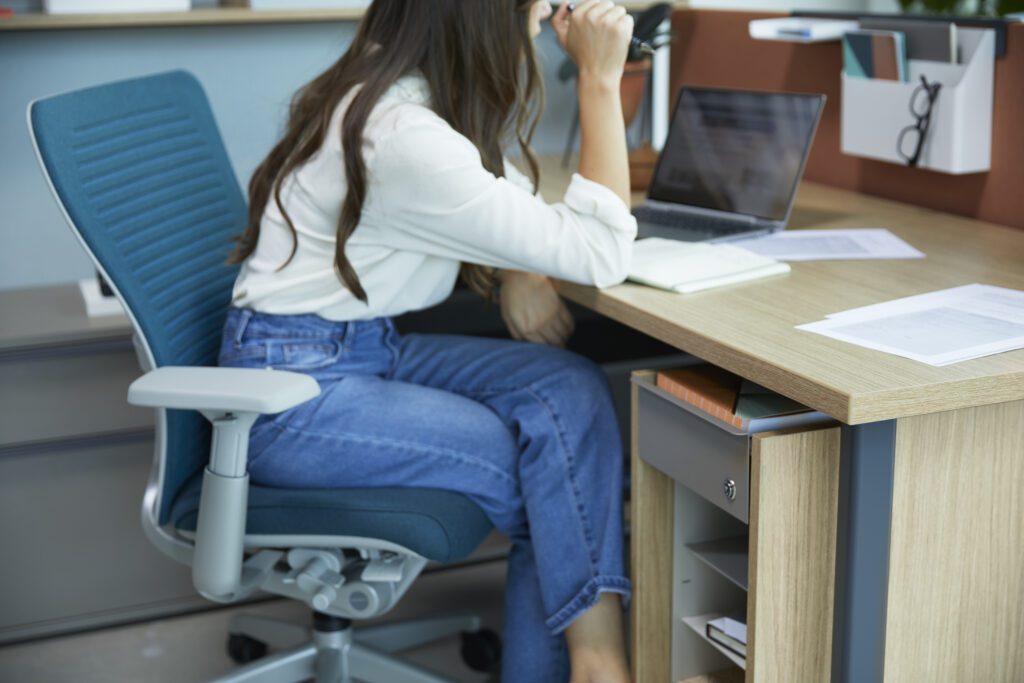 Zody task chair with digital knit back. Shown with Be_Hold storage.